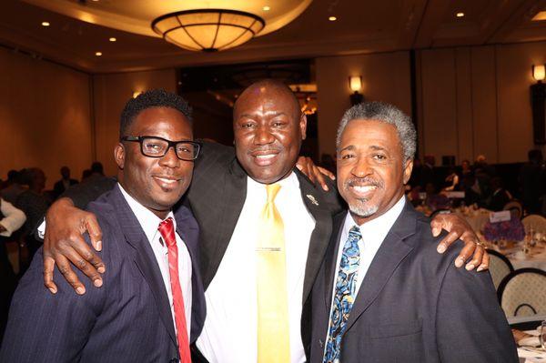 Attorney Kweku Darfoor with Benjamin Crump and Clinton Jones, father of Corey Jones at a scholarship luncheon in West Palm Beach.