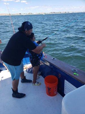 Matt helping my daughter learn to fish