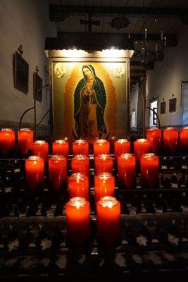 Our Lady of Guadalupe. Candles can be purchased from the gift shop