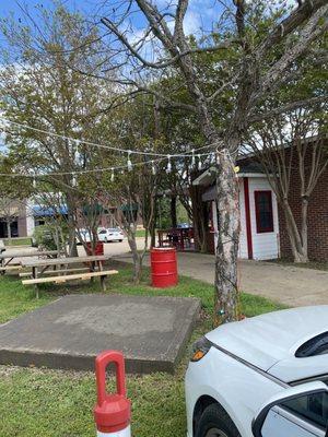 They have a drive-through window. There are picnic tables and nice outdoor lighting.  No inside dining.