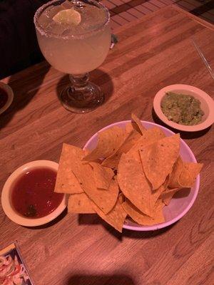 Chips, salsa, guacamole (extra charge for guacamole) and a margarita on the rocks.