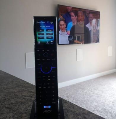 Basement media room with 75" Samsung, 7.1 surround sound, and RTI programmable remote.