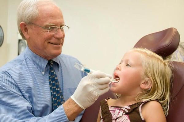 Dr. Dixon counting teeth