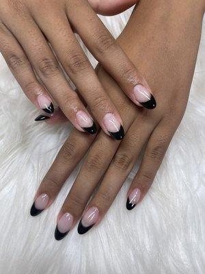 Acrylic set with black French tips.