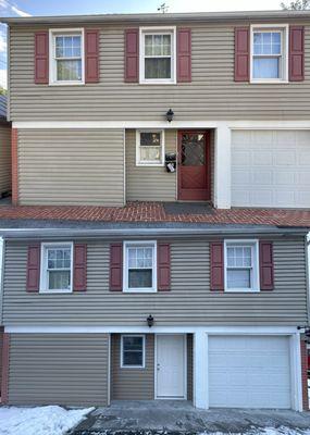 Before and after of an entry wall rebuild. Brand new siding, window, and door in a well-insulated 2x6 wall!