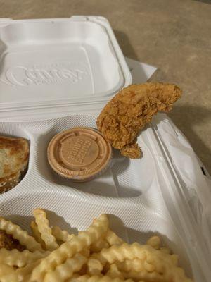 Smallest chicken finger I've ever seen from Cane's. Almost looks like it was cut in half and thrown into the fryer.