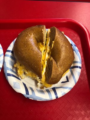 Egg and cheese on a wheat bagel.