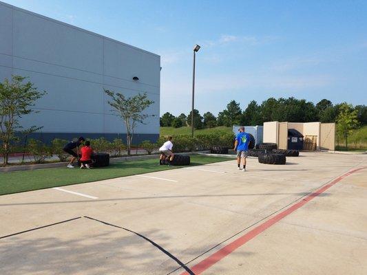 Youth Multi-Sports and Fitness Summer Camp.  Tire flips