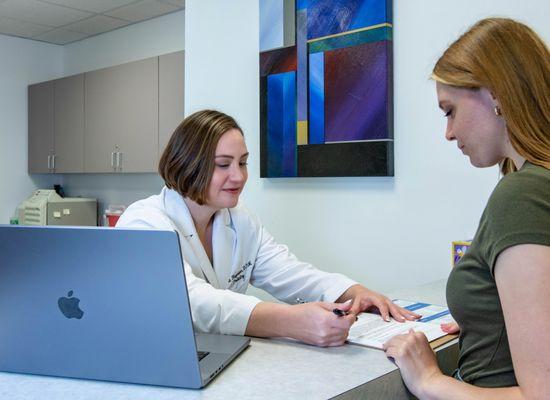 Dr. Hagmann consults with a patient.