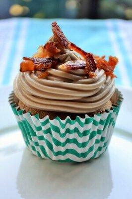 Moist maple cupcake, topped off with maple cream cheese frosting, bacon crumbles and a drizzle of pure maple syrup.