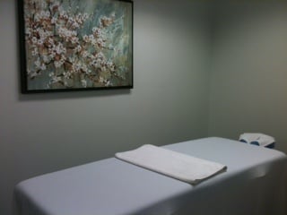 A peek at one of our massage rooms. Dimmer switches quiet the lights.