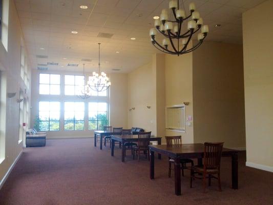 big clubhouse/rec center..heart using this spacious hall...full kitch far right..restrooms mid right..living rm area front right