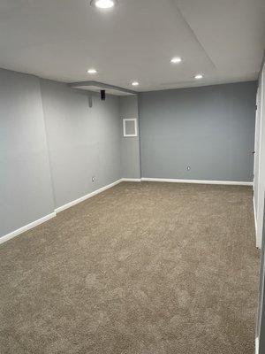 "Basement finishing project including framing, drywall installation, texturing, and painting."