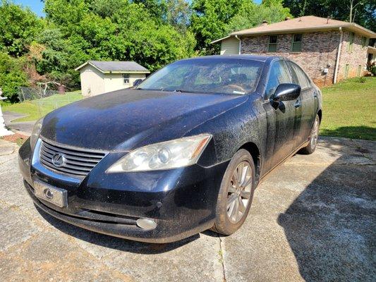 Lexus with a lot of grime and dried up pollen