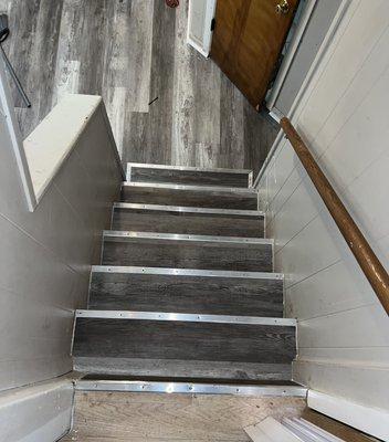 Replaced vinyl sheet with Luxury Viny Plank in basement floor and stairs