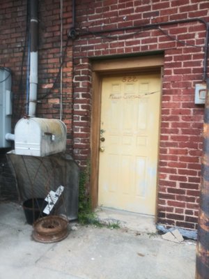 Sign Magic Happens behind that happy, yellow door.