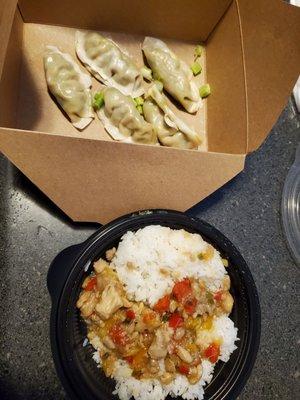 Veggie dumplings and a very sad bowl of orange chicken