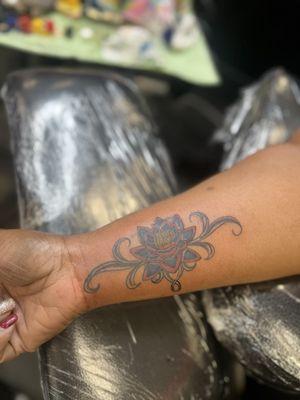 Old tattoo covered up with lotus flower