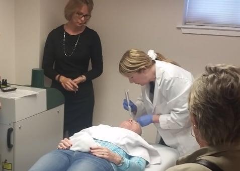 Nurse Elena performing a Micro-Needling treatment.