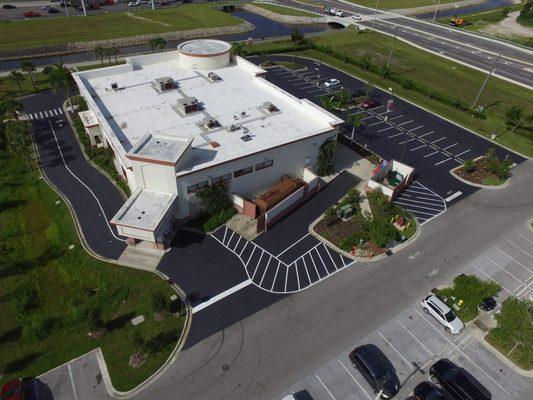 Aerial view of a business parking lot that has been freshly redone.