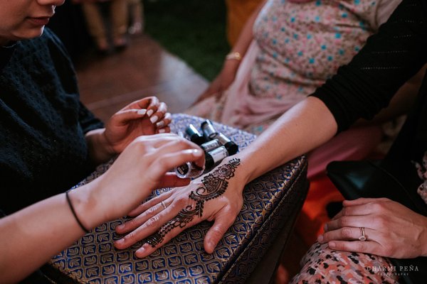 Applying glitter for henna night