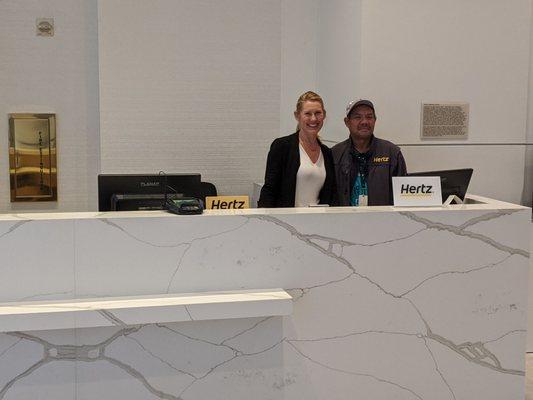 Melisa, Manager Associate & Noli, Utilities Specialist and Driver at their new counter in Hyatt lobby.