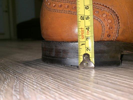 Inside of the left shoe: under an inch in height