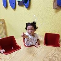 Toddler student playing with bubbles