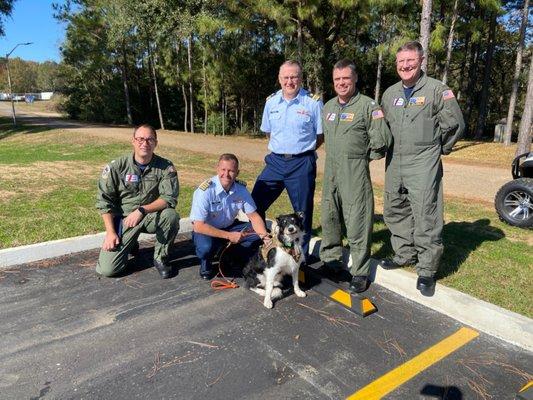 Taz taking a break from hazing geese at the Coast Guard and getting some extra attention.