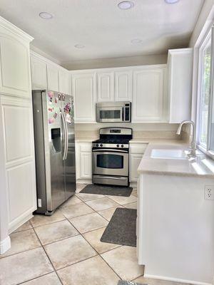 After! Max redid the trim at the bottom of the top cabinets as well. So bright and airy