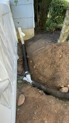 Connecting gutters/spouts to front drain - out to street.