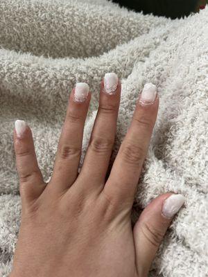 Lina's  white acrylic that won't come off.