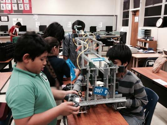 Trojan Robotics Outreach training 4th graders in robotics basics