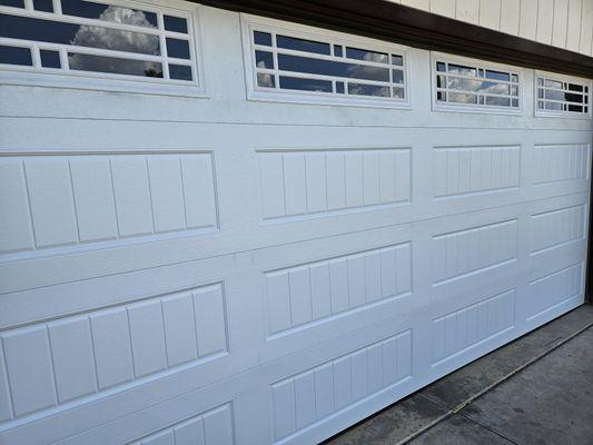 New garage doors spring motor cables crack in the panel new doors New motors New springs new brackets new bearings cables and more