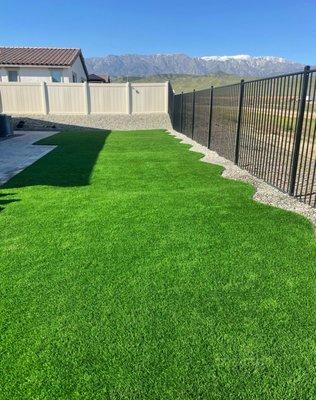 Backyard landscaping. Articulate grass, gravel and pavers in Beaumont