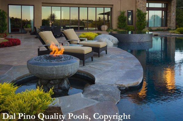 Serenity redefined!  Stone & water features flow around a modern masterpiece. #backyarddesign #dalpinopools