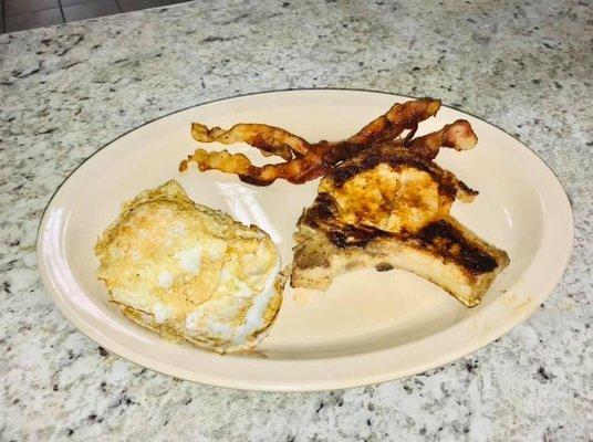 Pork chop bacon and over easy eggs