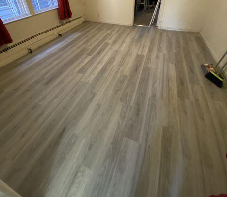 Dining room new installation of the Silver Fox Vinyl flooring before was old wooden floors.