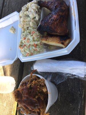 Cup of pulled pork, 1/4 chicken, potato salad, and coleslaw