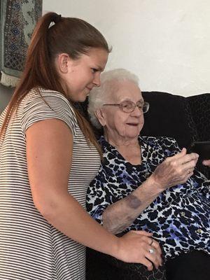 Brianne sharing modern technology with Grandma Ruth