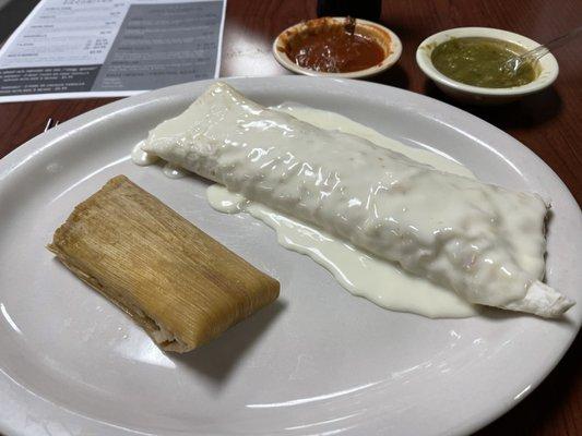 Pork Tamale and Bean with cheese burrito covered in delicious queso.