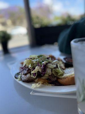 Brisket sandwich with bechamel Mac and cheese with slaw.