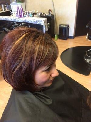 Highlights added to a rich auburn red. Easy 10 foil application.  Great results.