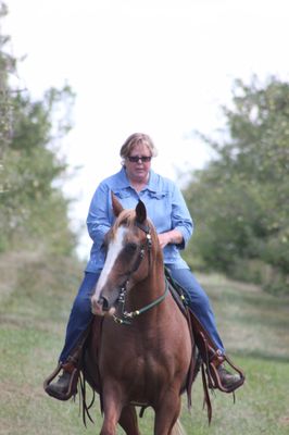 Beautiful day riding in the apple orchard