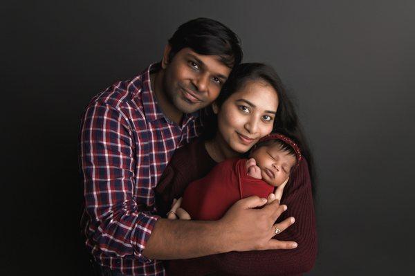 newborn photoshoot baby girl with mom and dad