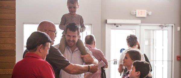 Family smiles at Linworth Road Church in Columbus, Ohio.