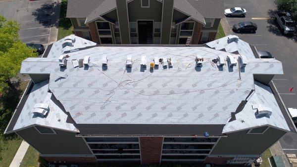 We installed IKO Cambridge IR shingles in Weatherwood on this apartment building.