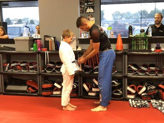 One of the kids getting a stripe in his belt at Indiana Brazilian Jiu-Jitsu Academy.