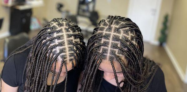 Medium size Knotless braids on twin sisters