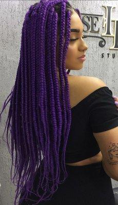 Pox braids with purple feed in  hair